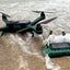 xpece-one-fishing-drone-bundle-drone-and-remote-displyed-on-beach-in-water