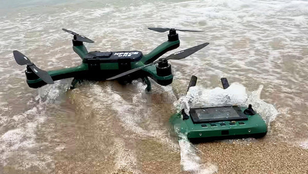xpece-one-fishing-drone-bundle-drone-and-remote-displyed-on-beach-in-water